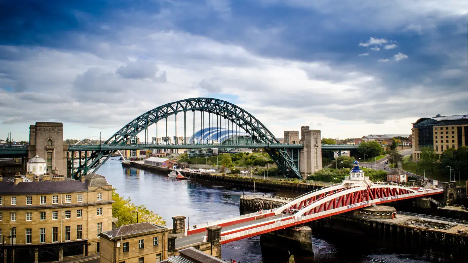 The Tyne Bridge and Swing Bridge over the river on Newcastle's Quayside.